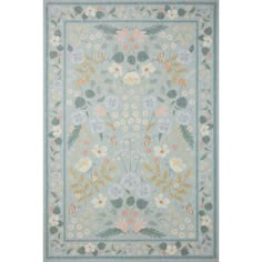 a blue rug with flowers and leaves on it