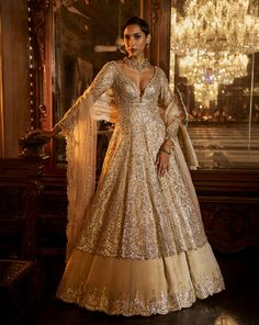 This contrasting jacket set features intricate gota patti embroidery on a grey silver tissue silk base. The outfit is paired with a soft gold embroidered skirt and an ivory tissue organza dupatta.From Seema Gujral's Falaknuma collection. DELIVERY TIMEPlease allow 8-12 weeks for your outfit to arrive. FABRIC DETAILSLehenga & Jacket - Tissue Silk Dupatta - Organza Professional cleaning only. Gota Patti Embroidery, Jacket Lehenga, Gold Jacket, Organza Dupatta, Embroidered Skirt, Gray Suit, Silk Dupatta, 12 Weeks, Professional Cleaning