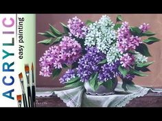 a painting of purple and white flowers in a vase next to paintbrushes on a table