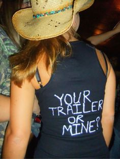 a woman wearing a cowboy hat with the words your trailer or mine? on it