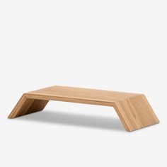 a wooden table that is made out of wood and has an angled design on the top