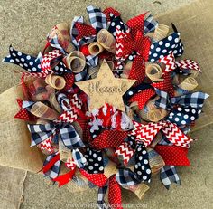 a wreath made out of burlocks and ribbon