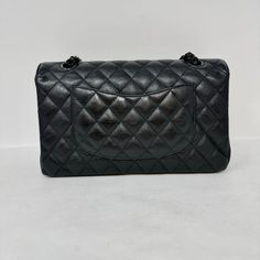 Chanel Classic Medium Double 2017 - 2018 Flap Bag with Black Hardware, Turn-Lock Closure at Front (includes Dustbag, Box and Authenticity Card) Designer = Chanel Color = Black Material = Leather Condition = Good Height = 6 Width = 10 Depth = 3" Class = Premier Location: Wilmette Item Number: 20201-62 Item ID: 300612 Category: Shoulder Bag High-end Black Bag With Removable Pouch, High-end Bags With Cc Turnlock Closure And Double Flap, High-end Black Bags With Detachable Strap, High-end Black Bags For Daily Use, High-end Black Bag For Daily Use, Classic Travel Bag With Cc Turnlock Closure, Designer Black Top Handle Bags, High-end Black Rectangular Bags, Black Double Flap Bag For Daily Use