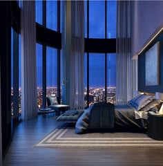 a bedroom with large windows and a view of the city at night from it's floor to ceiling bed