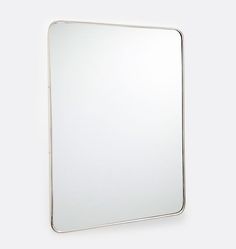 a white square mirror hanging on the wall