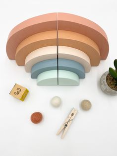 a group of different colored objects sitting on top of a white table next to each other