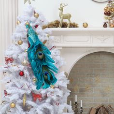 a white christmas tree decorated with peacock feathers