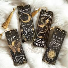 three bookmarks with the words, eyes open and one has a dragon on it