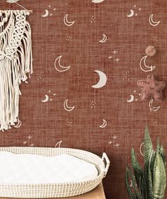 the wallpaper in this room is decorated with stars, moon and crescents