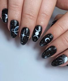 Add a touch of celestial vibes into your nail art with this elegant nail design. A black base with white starry skies and crescent moons can be a great addition to your Halloween look. Nail Art Designs Witchy, Black Space Nails, Full Moon Nails, Summer Witchy Nails, Black Celestial Nails, Eclipse Nails, Black Witchy Nails, Mystical Nails, Racing Nails