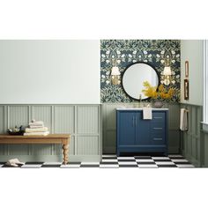 a bathroom with checkered flooring and green walls