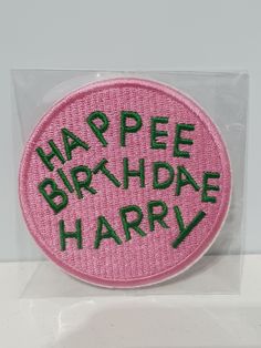 a badge with the words happy birthday harry on it