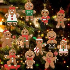 a christmas tree with many ornaments hanging from it's branches, including gingerbread men and women