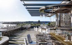 an outdoor dining area with tables and chairs