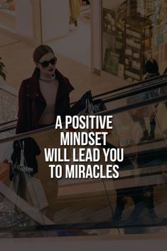 a woman riding an escalator with the words positive mindset will lead you to miracles