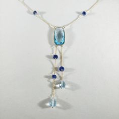 **KINDLY CHECK OUT THE VIDEO OF THE ITEM FOR A CLEARER VIEW**Details of the Necklace: Length of necklace is 16 inches. Other sizes available on request. Gemstone : Sky Blue Topaz Gemstone shape, size and weight- cushion , 20x10mm,10.08 carats Blue sapphire beads-3mm, 9ec,5.55 carats Sky blue topaz drops-7x5mm,3.25 carats, 2 pec Total Gemstone weight: 18.88 carats Metal: GOLD Purity: 14K (58.33%)approx Gold Weight: 1.63 grams Total weight: 5.41 grams Aunthtic sky Blue Topaz cushion, blue sapphire Sapphire Beads, Blue Sapphire Necklace, Handmade Gold Jewellery, 16 Inch Necklace, Necklaces Women, Blue Topaz Necklace, London Blue Topaz Ring, Blue Topaz Gemstone, Topaz Necklace