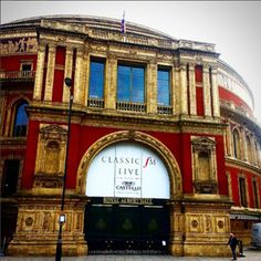 an old building with a sign that says classic at the front and side of it