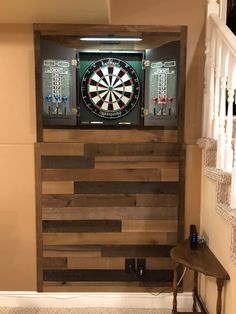 a dart board mounted to the side of a wall