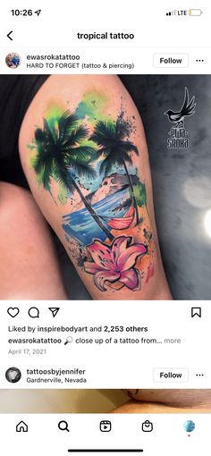 an image of a woman's leg with tattoos on it and palm trees in the background