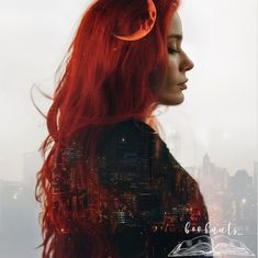 a woman with long red hair standing in front of a city skyline