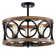 a light fixture with wood and metal accents