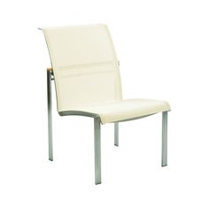 a white chair sitting on top of a metal frame