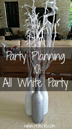 party planning 101 all white party with silver branches in a vase on a dining room table