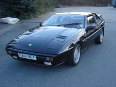 a black sports car parked on the street