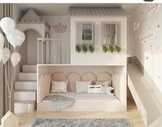 there is a doll house with stairs and a couch in the room next to it