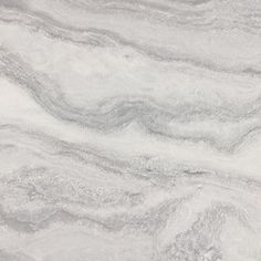 a white marble counter top with grey veinies