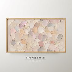 a painting hanging on the wall next to a wooden frame with words that read, nin art brush