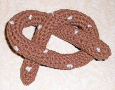 a crocheted dog toy is laying on the floor