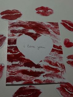 valentine's day card with red lips and i love you written on it