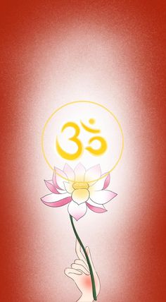 a hand holding a flower with the word om in it