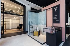 the interior of a store with pink and black walls