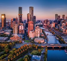 an aerial view of the city skyline at sunset