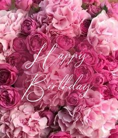 a bouquet of pink flowers with the words happy birthday