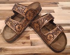 We handcraft each pair of Custom Birkenstocks to order. Reach out to us with your design requests and sizing after purchasing this listing and we will work with you to make a one of a kind design. Brown Hand Tooled Sandals For Festival, Artisan Hand Tooled Leather Sandals, Tooled Leather Birkenstocks, Festival Hand Tooled Brown Sandals, Brown Hand Tooled Open Toe Sandals, Festival Brown Hand Tooled Sandals, Tooled Birkenstock Sandals, Leather Birkenstocks, Leather Engraving