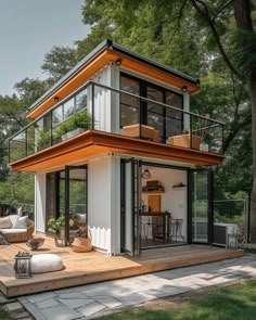 a small white house sitting on top of a wooden deck