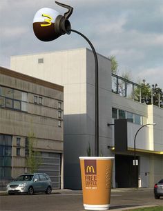 an image of a street light in front of a building with a mcdonald's logo on it