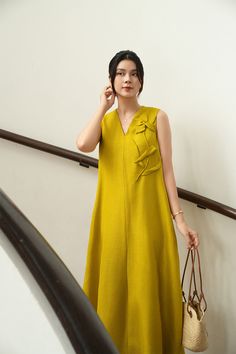 Made from high-quality linen, this dress features a loose, flowy silhouette and a flattering V-neckline. Perfect for any occasion, this dress is a must-have for those hot summer days.   *The picture is only for reference, the length of the real product will be different. Mean Blvd, Yellow Mustard, Silk Midi Dress, Flower Applique, Designer Collection, Mustard Yellow, Hot Summer, Silk Fabric, Summer Days