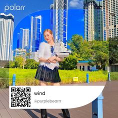 a woman is standing in front of a cityscape with the word wind on it