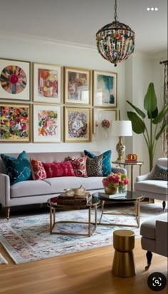 a living room filled with furniture and pictures on the wall above it's coffee table