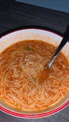 a bowl of soup with noodles in it