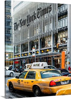 taxi cabs are parked in front of the new york times building