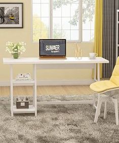 a computer desk and chair in a small room with yellow curtains on the windowsill