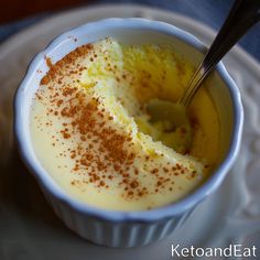 a bowl filled with pudding on top of a white plate