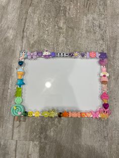 a mirror that has buttons on it and the words drew are spelled in small letters