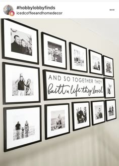 black and white photos hanging on the wall in front of a stair case with words above them