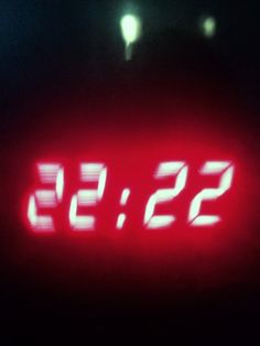 the time is 22 53 and it's red in the dark, with only one light on